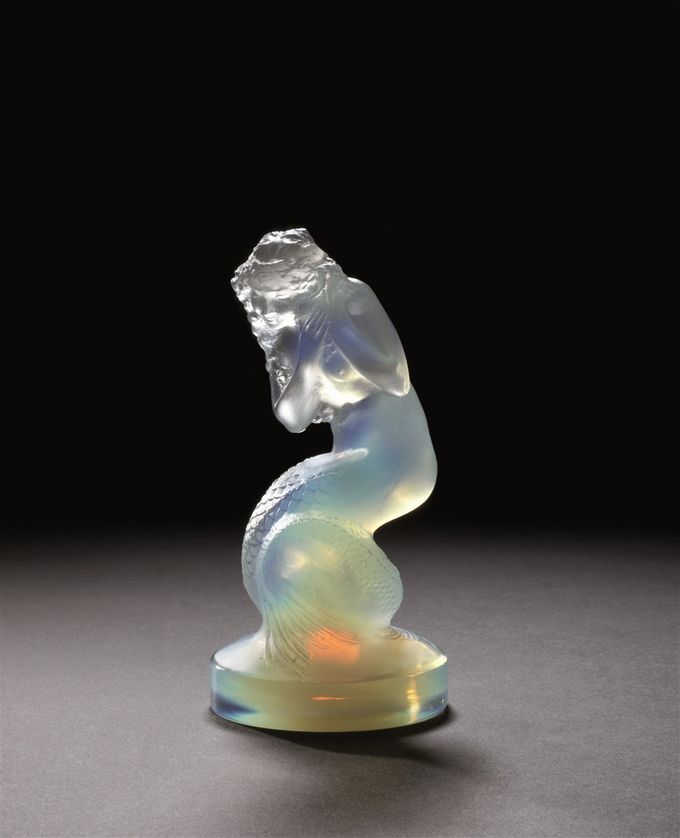 This superb Naiade (Water Maiden or Mermaid) is finished in a rare opalescent milky-blue with a fire-glow orange core.